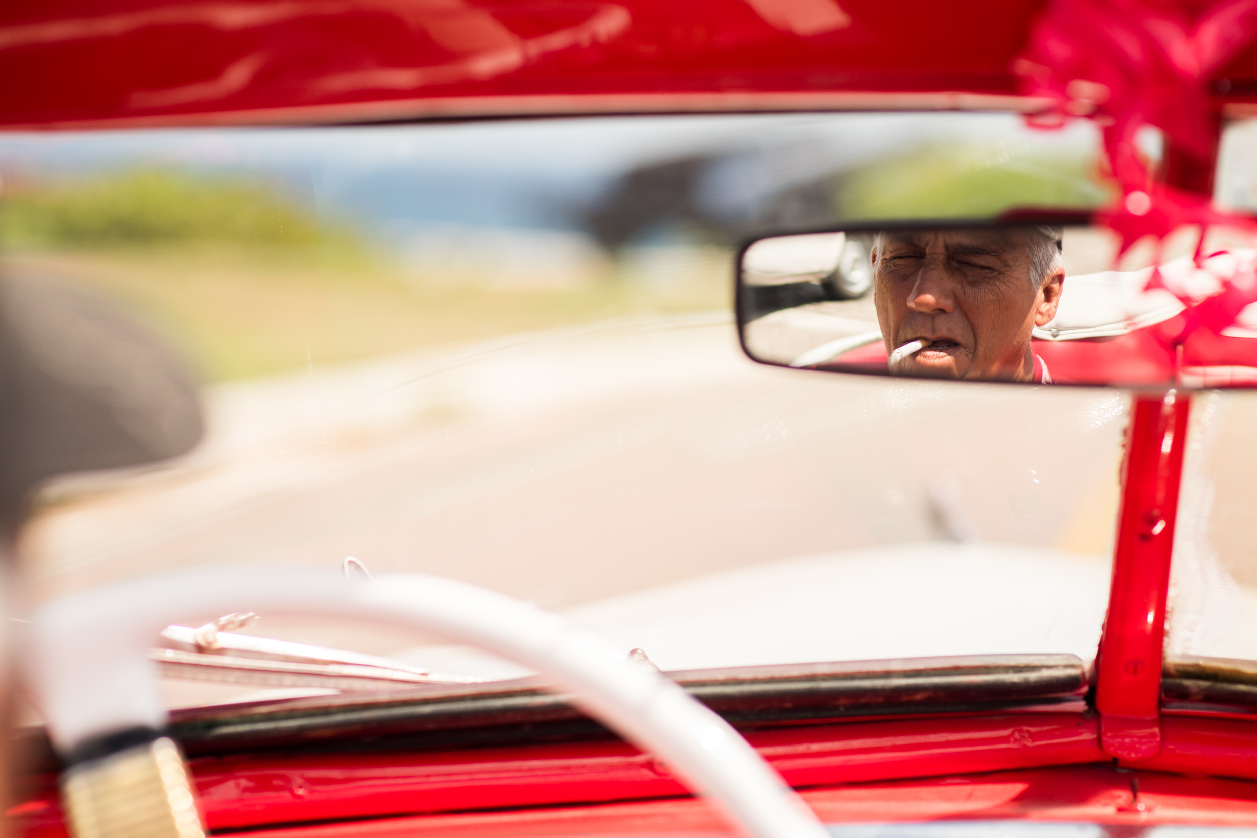 The owner of a 1948 DeSoto convertible, passed down from his father from his grandfather, makes a living driving tourists around Havana in his classic car.