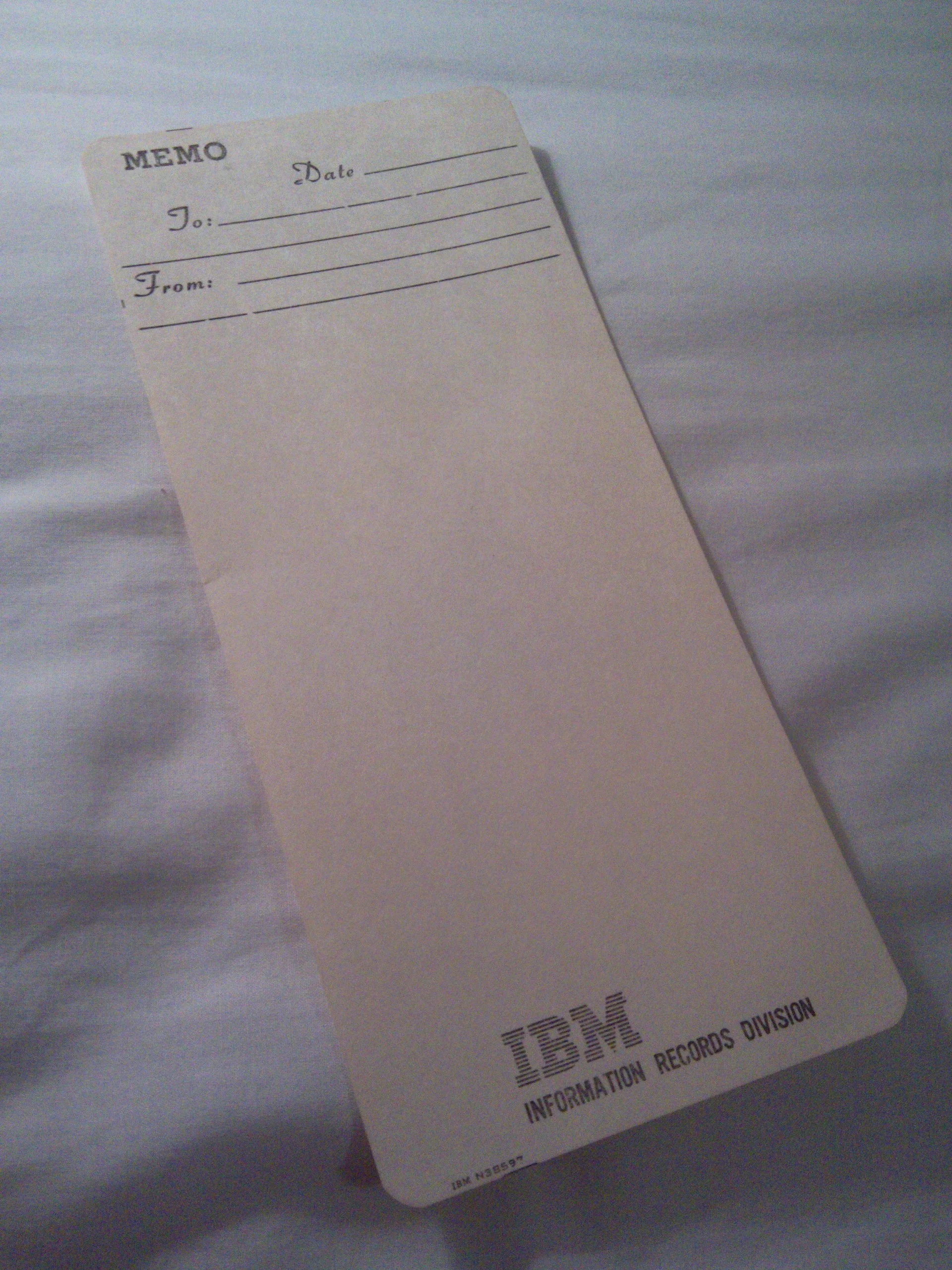 Bottom says "IBM Information Records Division, IBM N38597".Employees got these &amp; a personalized Lucite holder in lieu of notepads.&nbsp;Appears un-googleable. Would love to find a source of these online.Anyone?