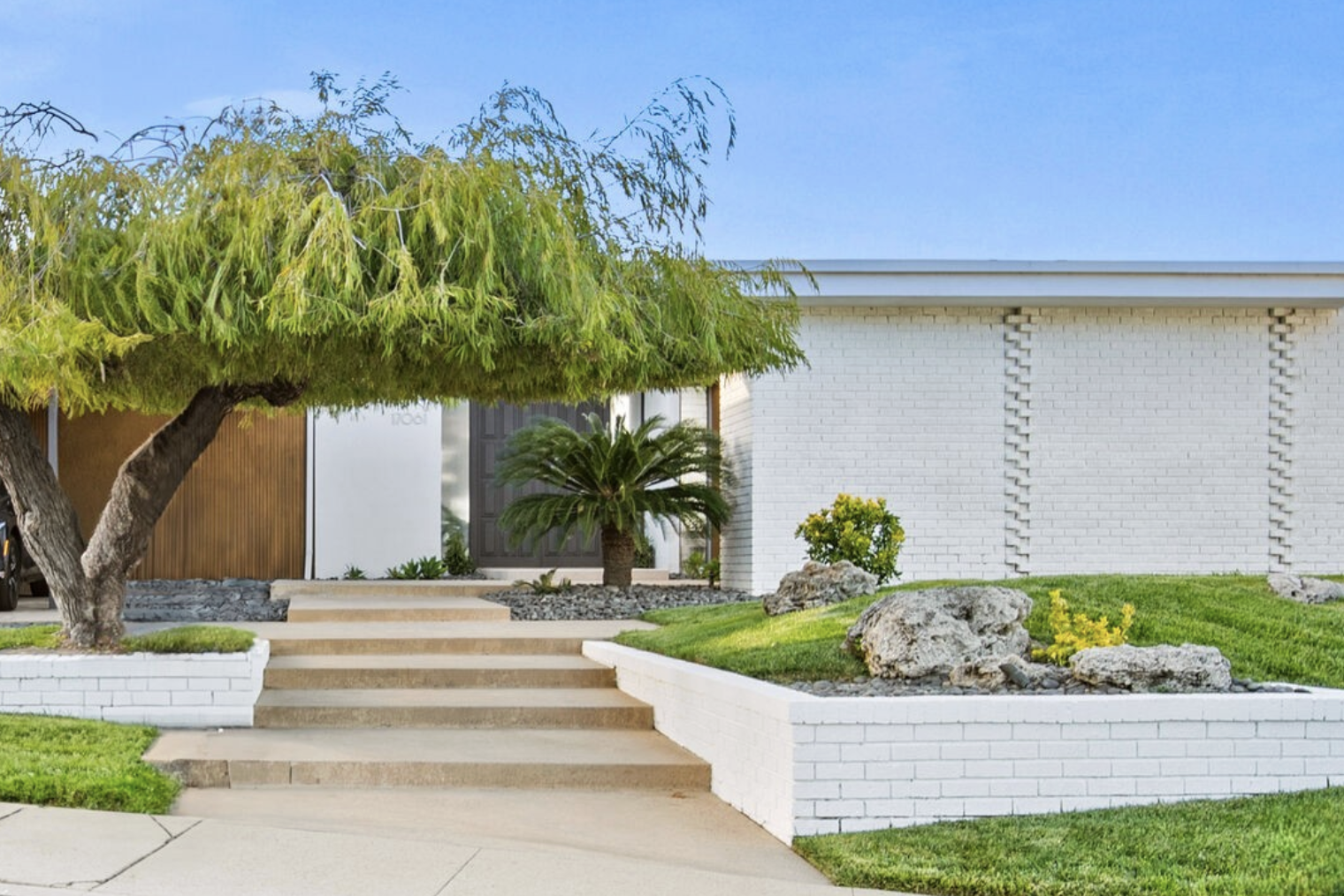 Benton & Park Strawberry House in Encino, a 1964 mid-century glass pavilion with ten-foot walls of glass overlooking the pool and the San Fernando Valley.