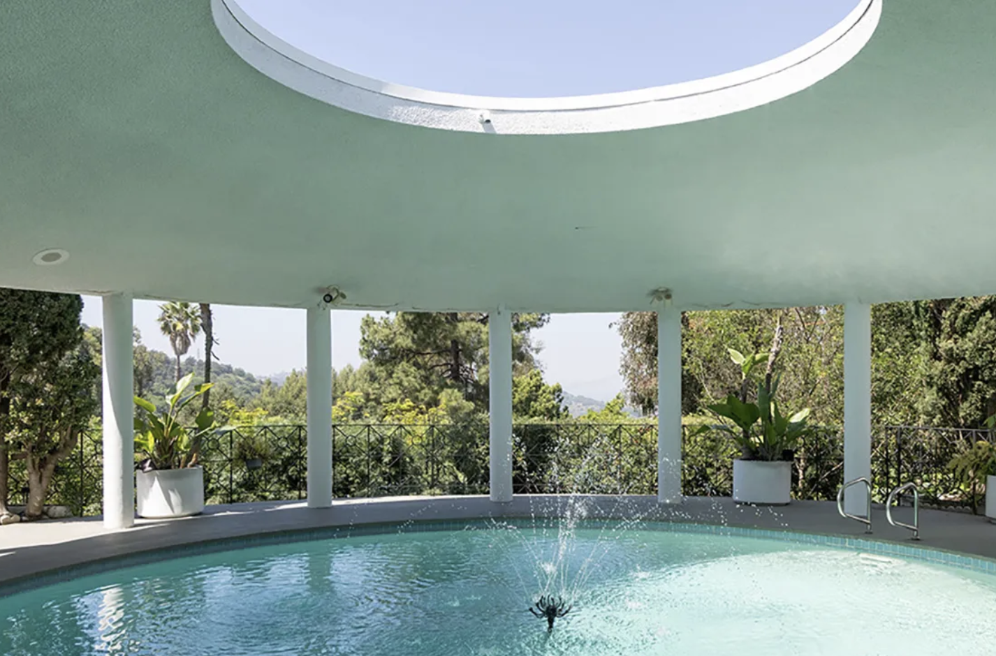 The Tempo House by Ray Kappe in the Hollywood Hills, built around a circular pool with an oculus open to the sky