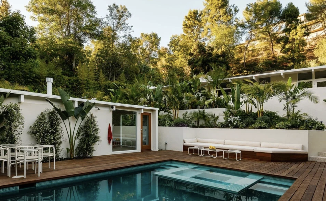 The 1954 Forrest Theriot House at 2544 Greenvalley Road in Laurel Canyon, a midcentury post and beam home with wood-framed glass walls and a front pool set into the canyon hillside