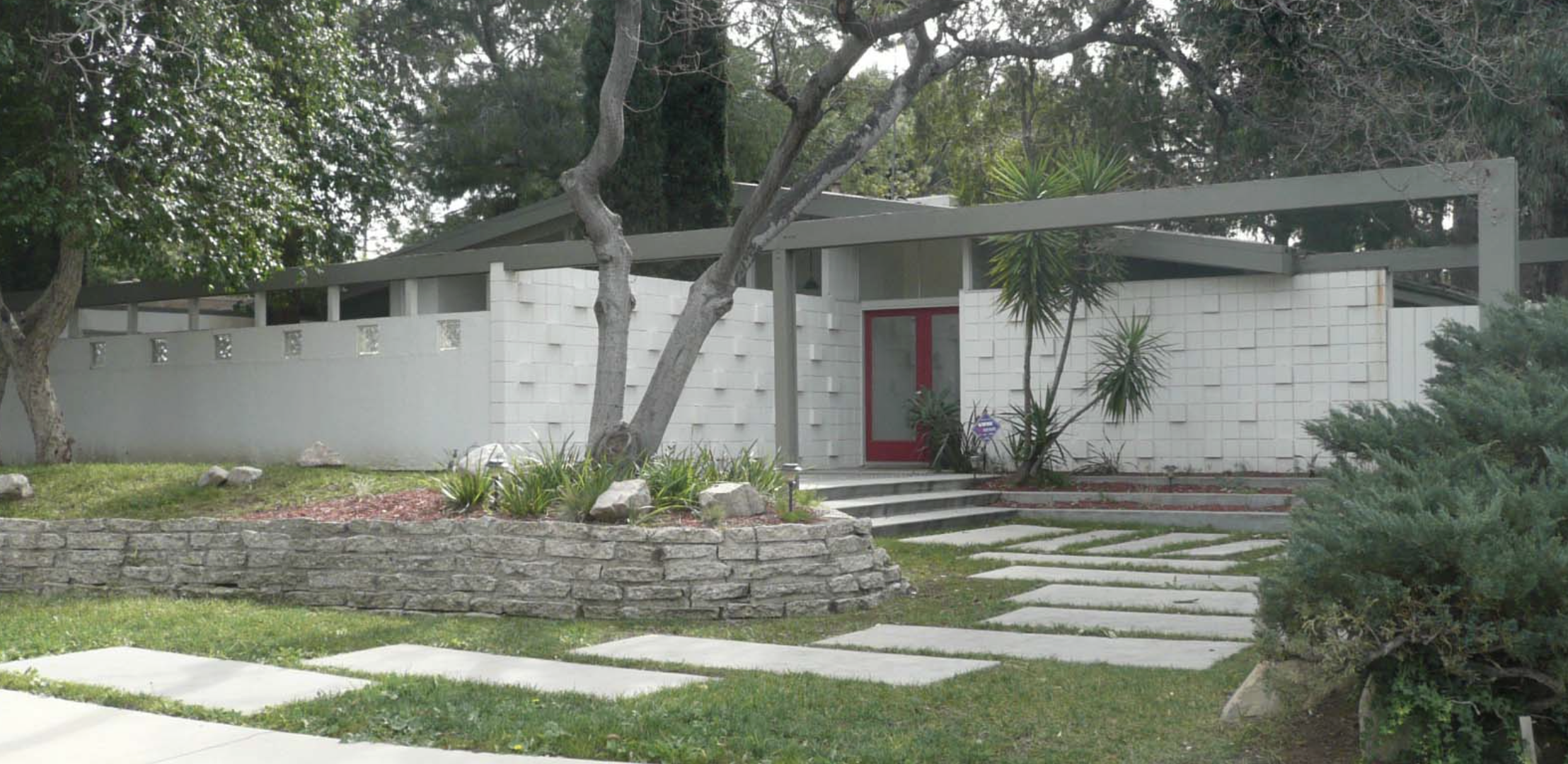 A Palmer and Krisel post and beam house with a clerestory window and carport on Jumilla Avenue in Corbin Palms, Woodland Hills