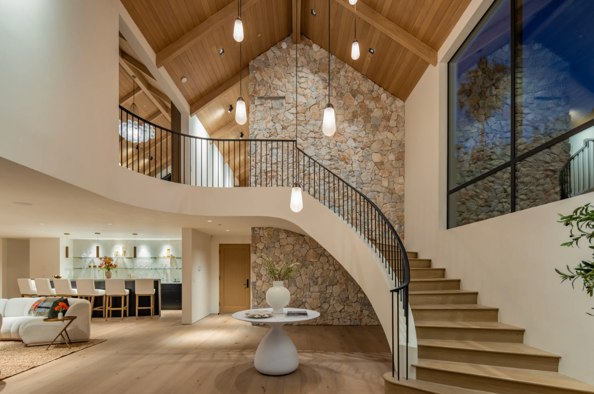12309 Viewcrest Studio City architectural compound, with floor-to-ceiling glazing oriented toward the Fryman Canyon ridgeline and the surrounding tree canopy framing the indoor-outdoor view.