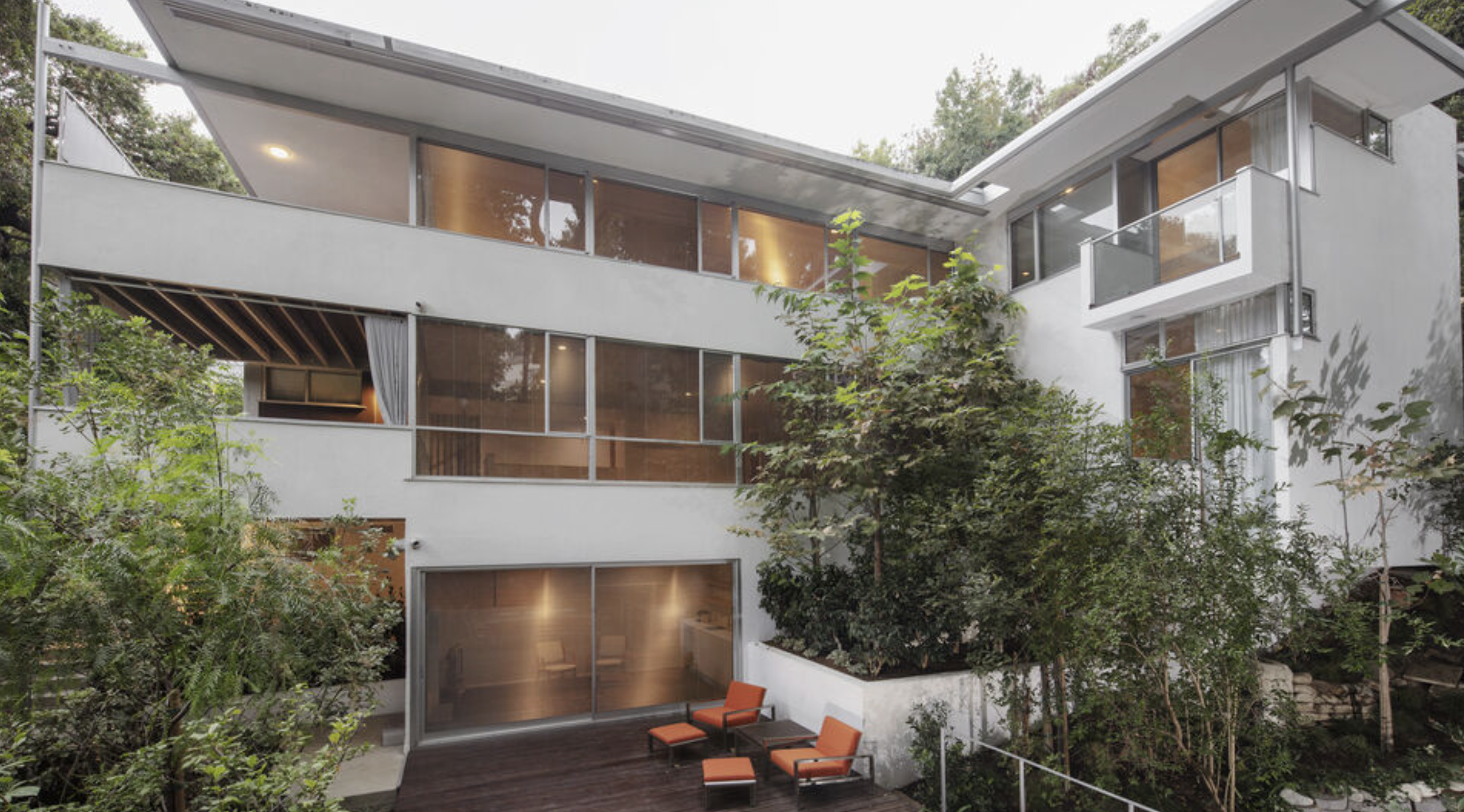Richard Neutra's Hendershot House in Nichols Canyon, Los Angeles, glass walls open to a wooded canyon