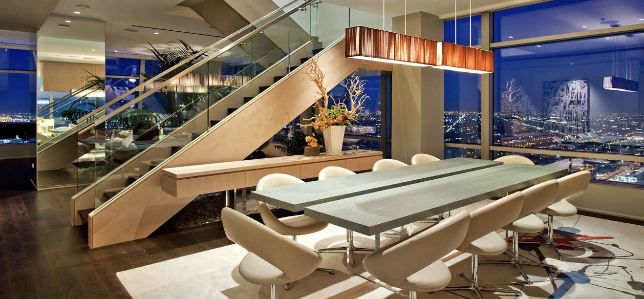 Beverly Hills branded residence building at dusk.