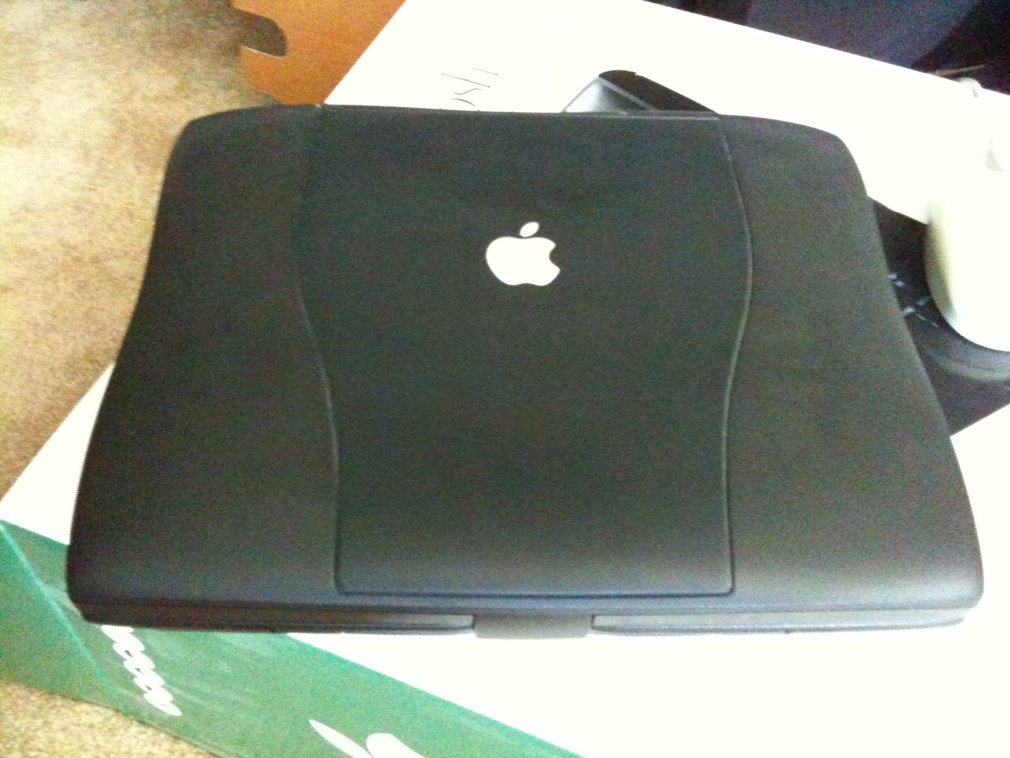 Wiping out an old school PowerBook to give to charity. 
