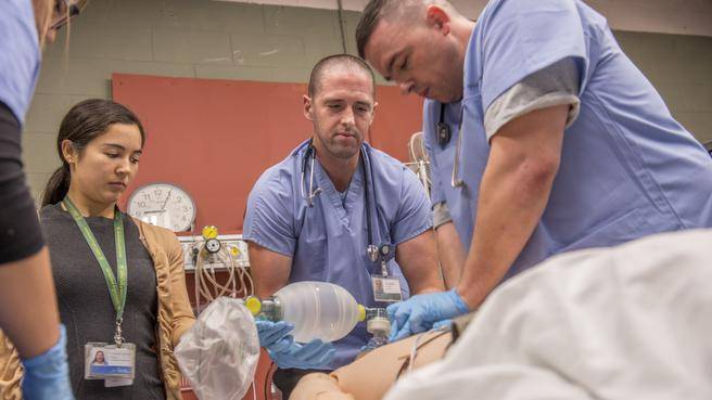 Fourth-year resident, Dr. Samantha Jang-Stewart (left), participates in a simulation training exercise at the Simulation Bay at the QEII Health Sciences Centre. (RPM Productions)