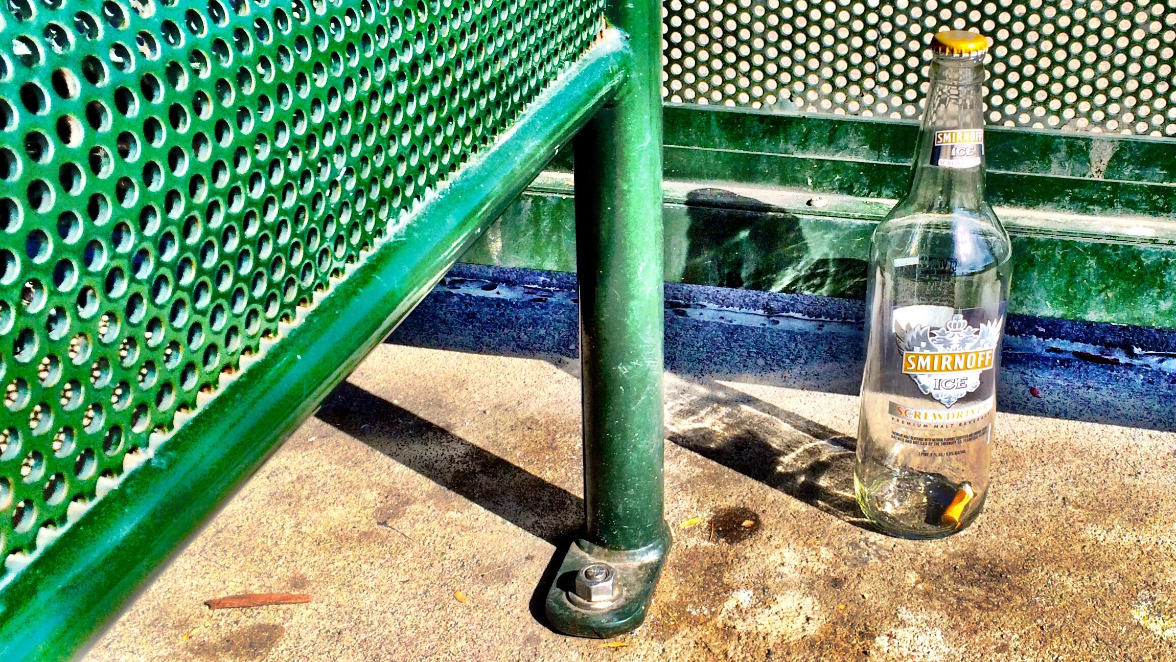 Smirnoff Ice bottle at a bus stop in Aurora, CO