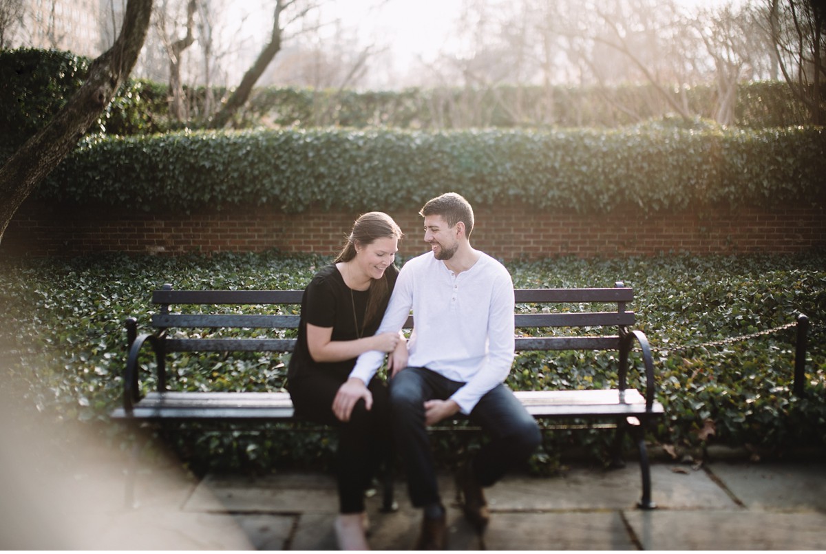 Artistic candid photo of engaged couple in Conservatory Garden, NYC