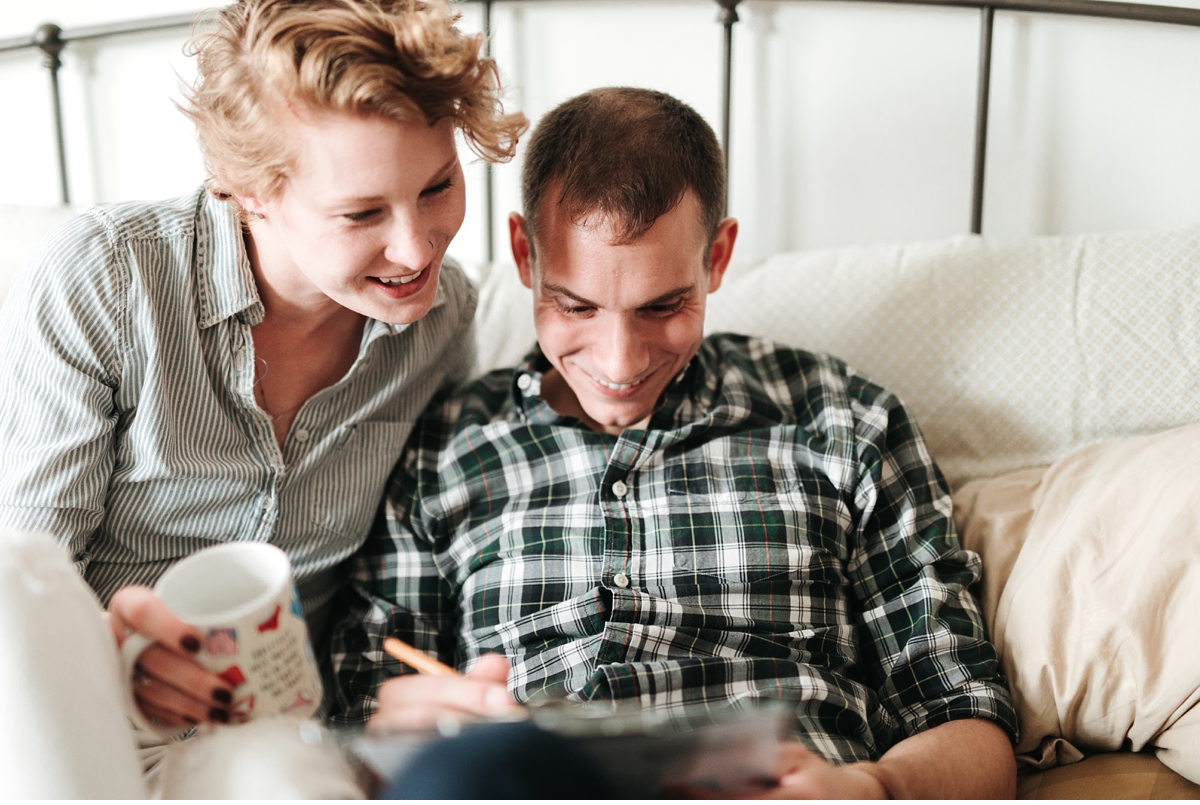 guy doing crossword puzzle in bed with fiancè-2