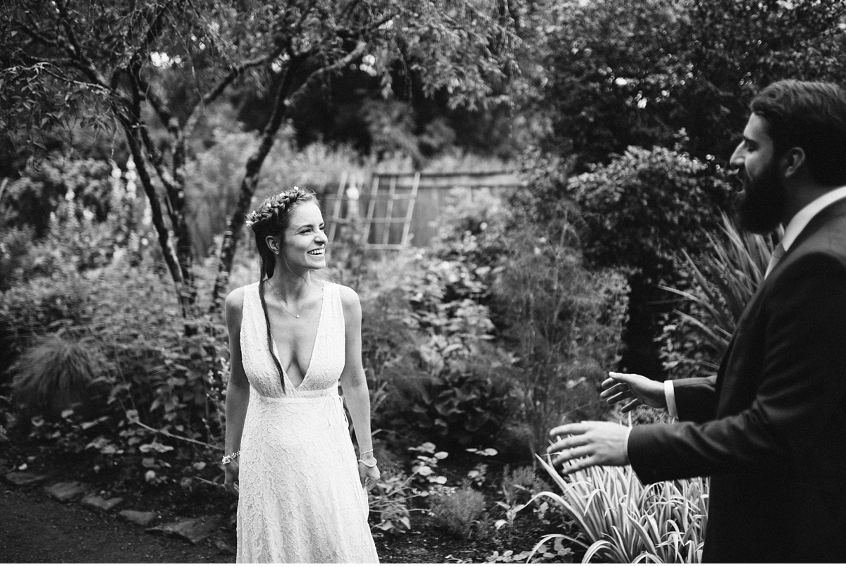 Bride walks towards groom for first look in Willowwood Arboretum-4