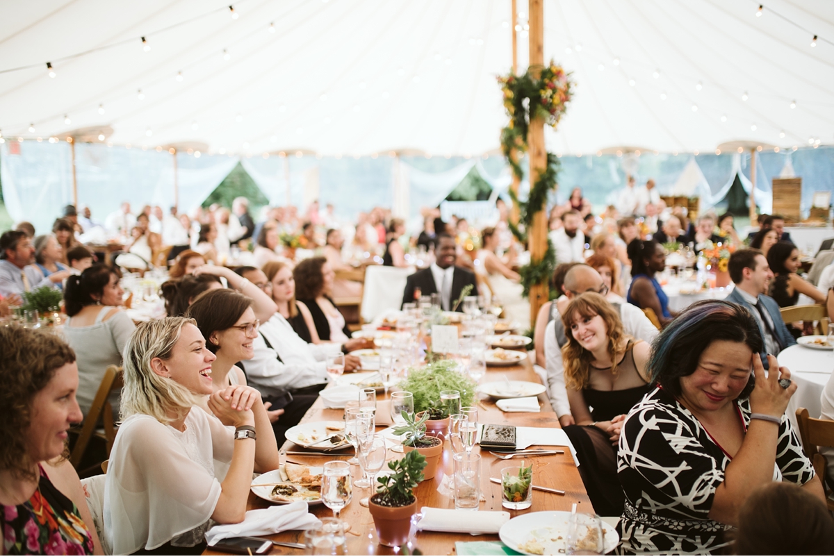 Laughing guests at summer wedding at Willowwood Arboretum