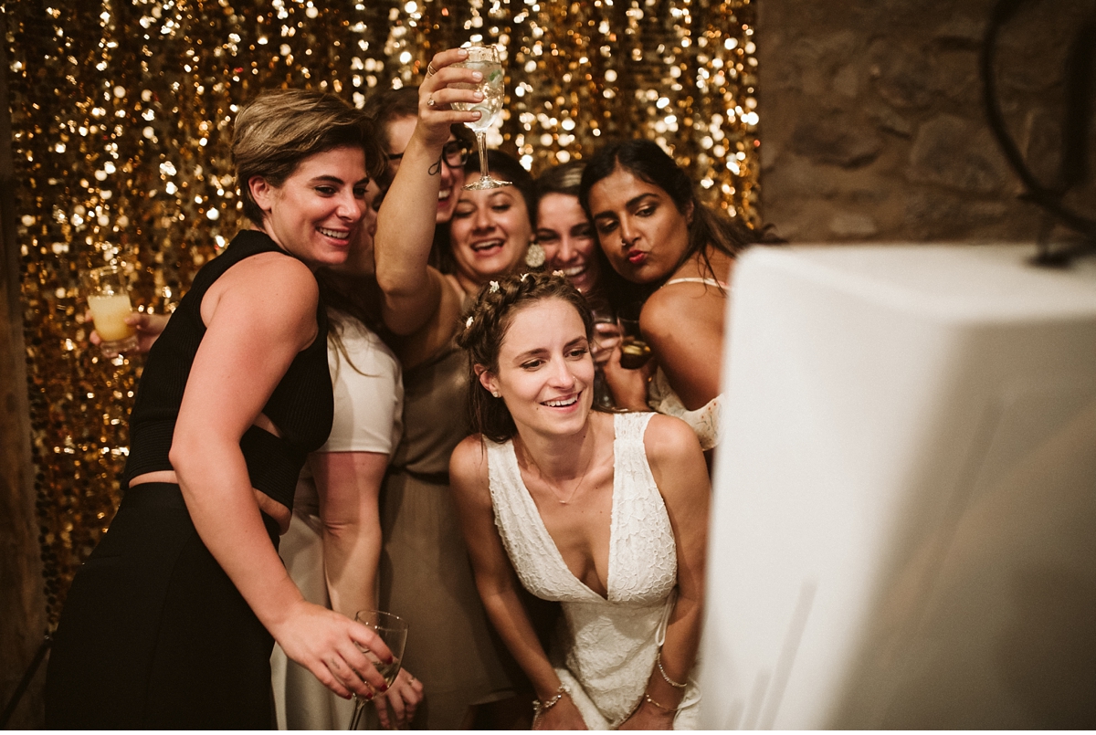 Bride and bridesmaids posing in photo booth at Willowwood Arboretum NJ