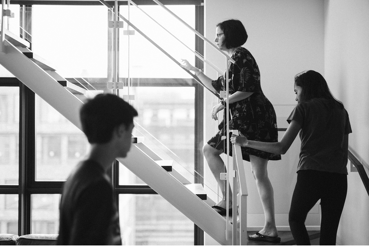 woman ascending stairs in trendy Wythe Hotel in Brooklyn NY