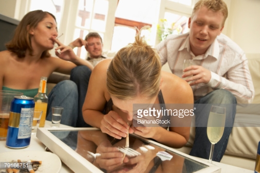 Photo by BananaStock/BananaStock / Getty Images - Yes, this is a stock photo you can license for ten bucks. It's called "Woman snorting cocaine at party". We're almost as excited as she's about to become.