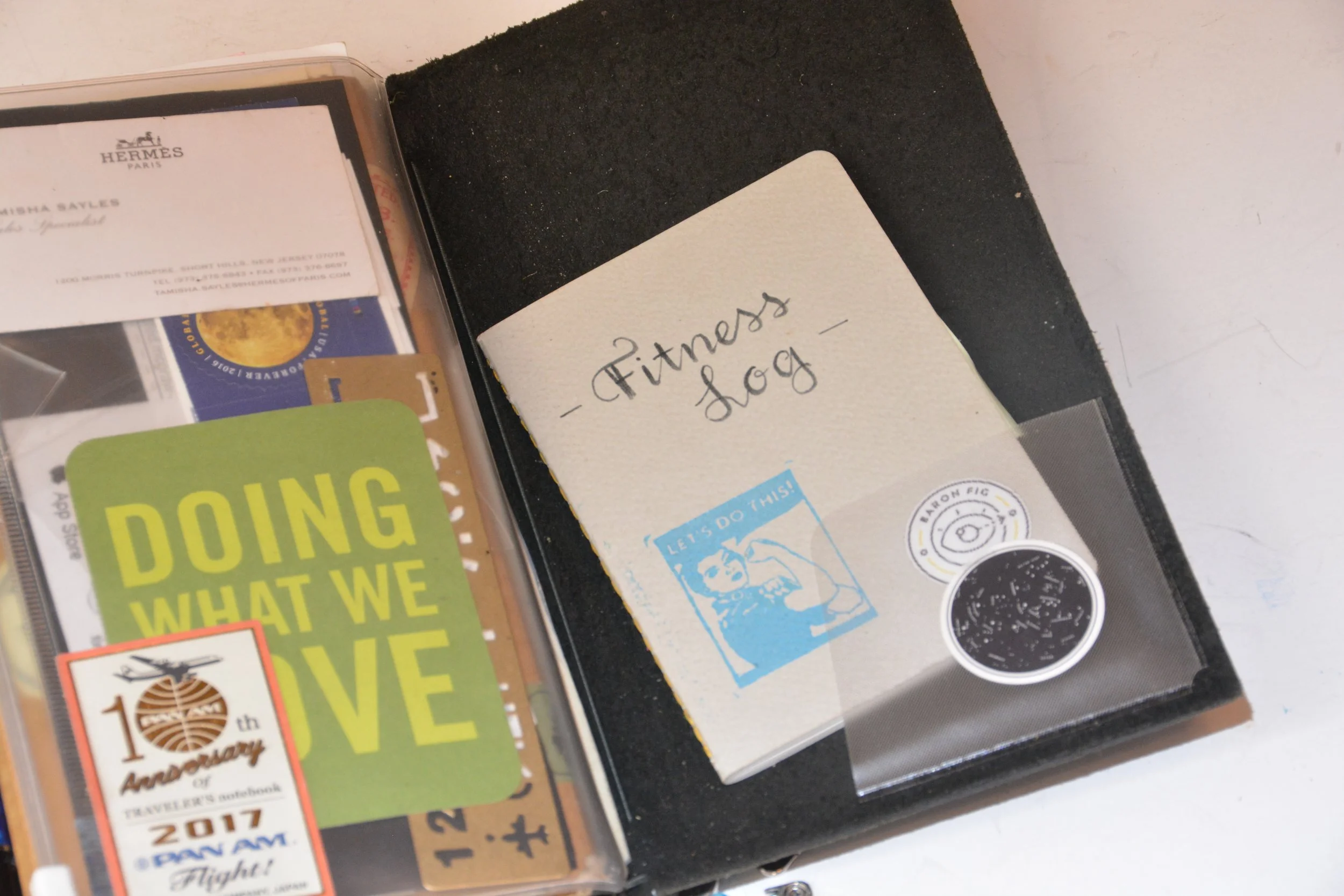 My zippered pouch serves to hold stamps an a few other items I need or want to have on hand, plus a reminder. Tucked inside a sticker pocket is my fitness log in a pocket size notebook by Baron Fig. 