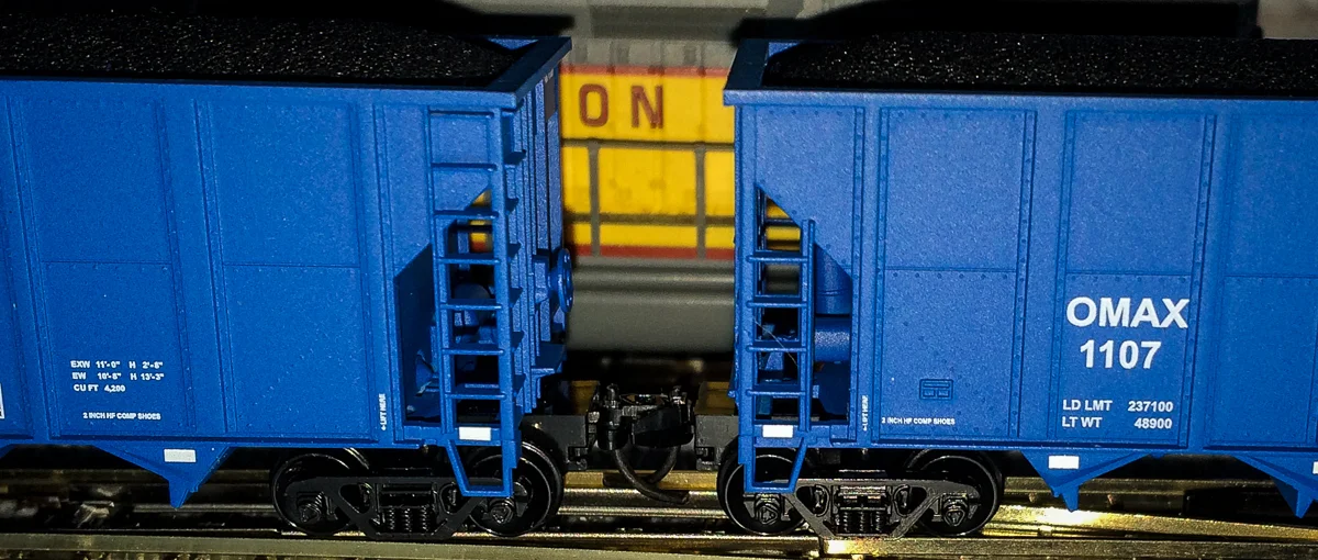 These N-scale hoppers cars are only about an inch high.