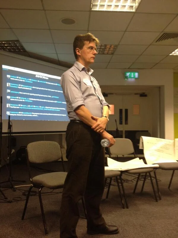 Simon Burall leading a shared pause to allow us to reflect upon the intense conversation