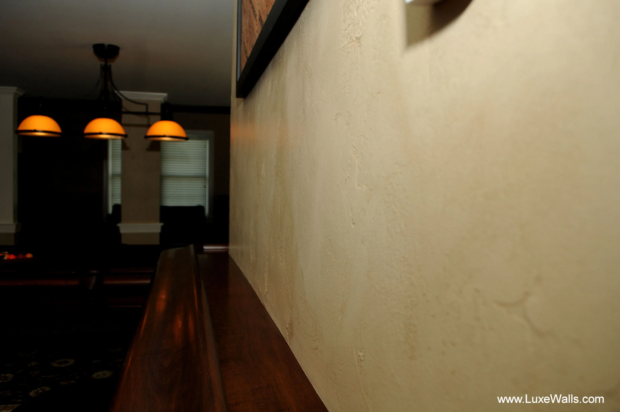 The main wall finish is this textured and glazed technique which serves to add warm and ambiance to the basement.