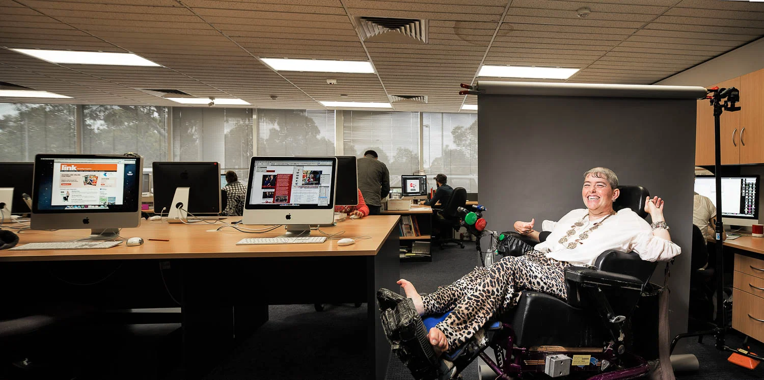 Jo Shepherd, part time graphic designer at work, for Cara (Community Accomodation and Respite Services) Annual Report with Nicknack