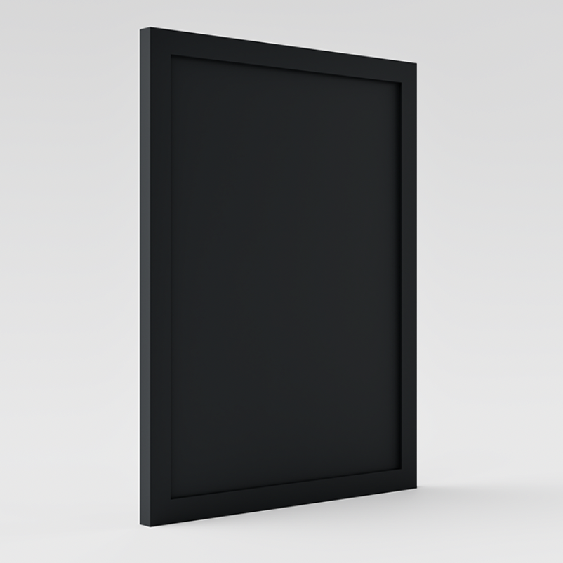 Affiche noire encadrée suspendue sur un mur blanc.