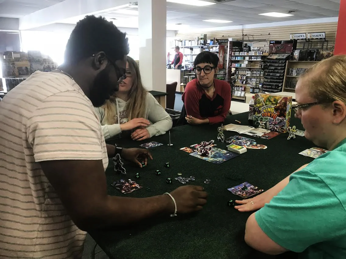 Devoted FLGS employee Jacinda teaches a group of three how to play one of our favorite games: King of Tokyo!
