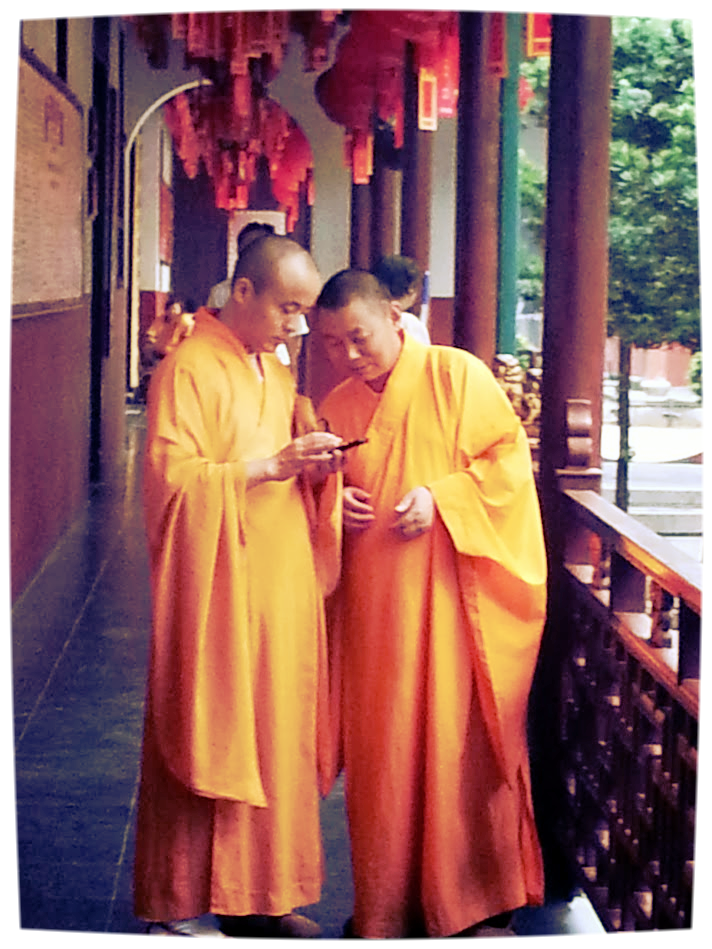 Buddhist Monks on their smartphone