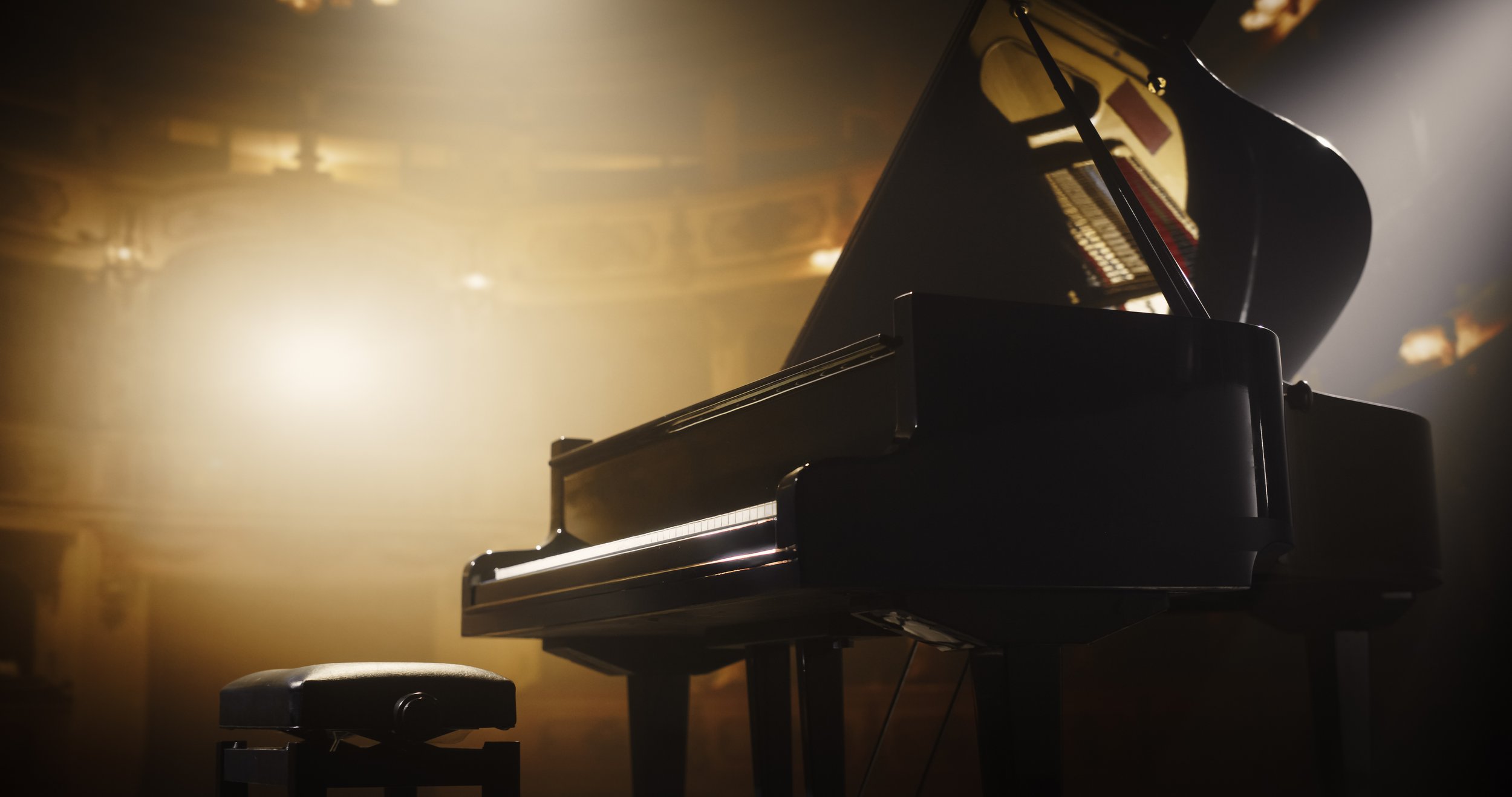 Grand piano in a performance setting, representing piano lessons and music instruction by Tiffin Fuhrman in Minneapolis St. Paul