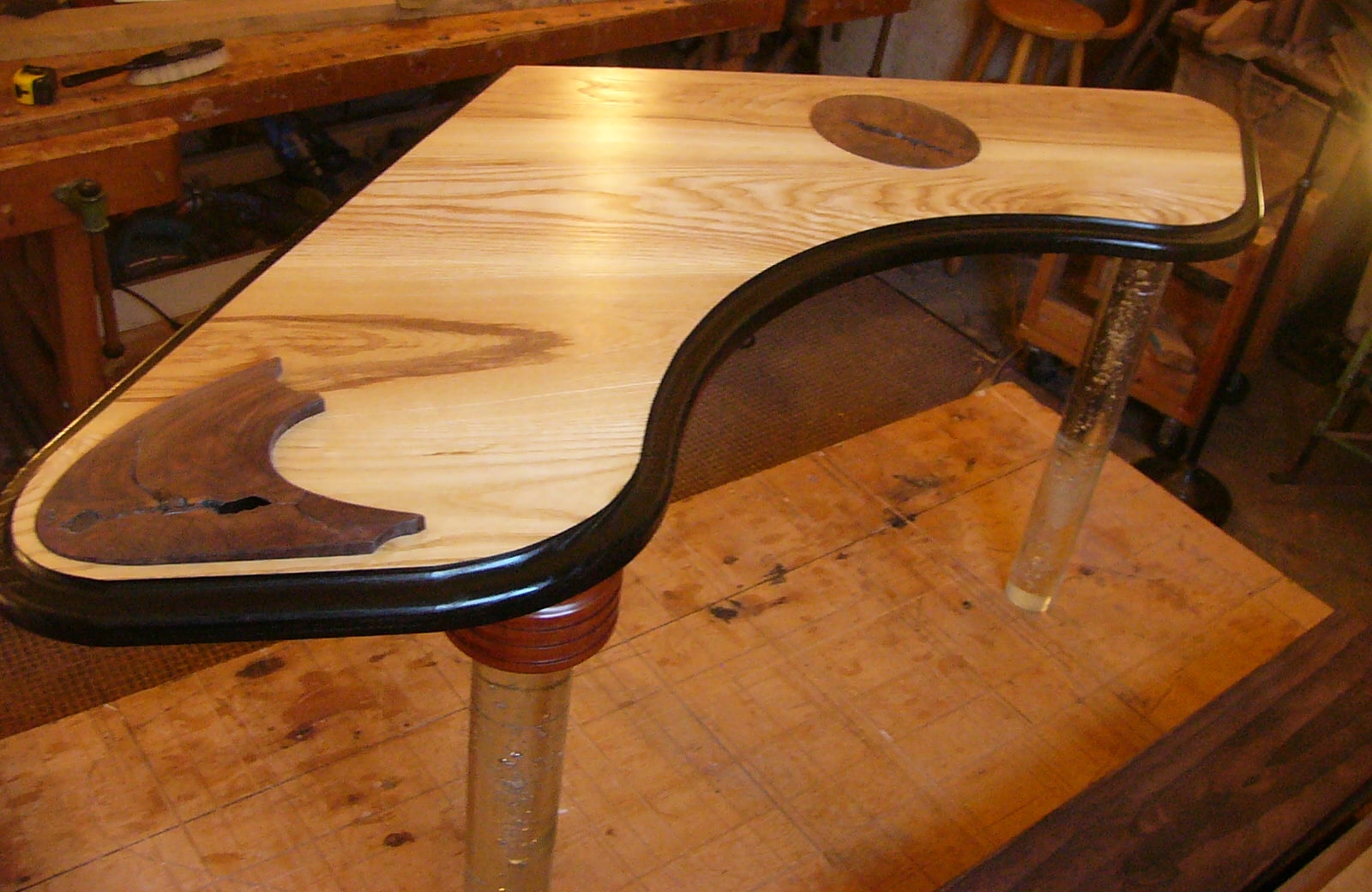 Walnut inlay boomerang top table with glass legs