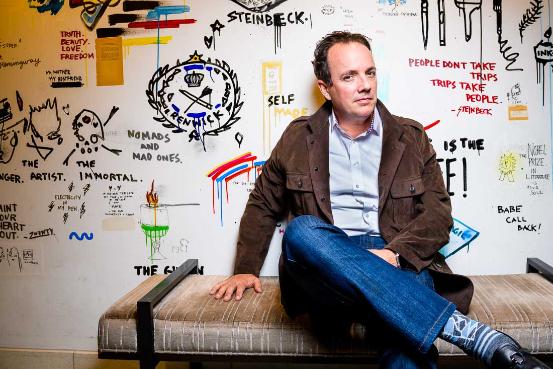 NYC Branded Lifestyle Portrait John Andrews sitting on ottoman