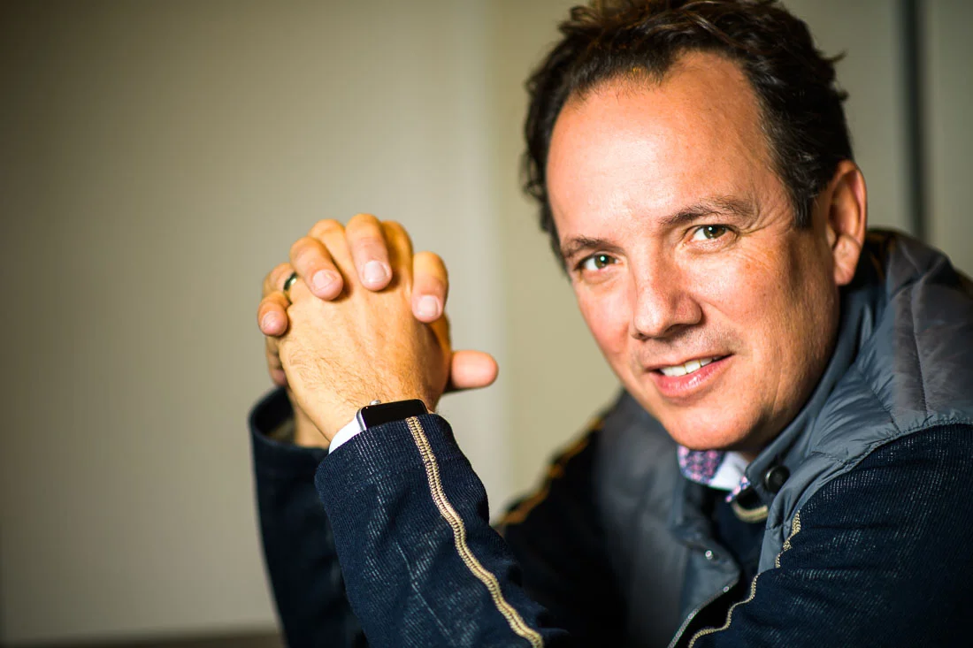 NYC Branded Lifestyle Portrait John Andrews hands folded looking to camera