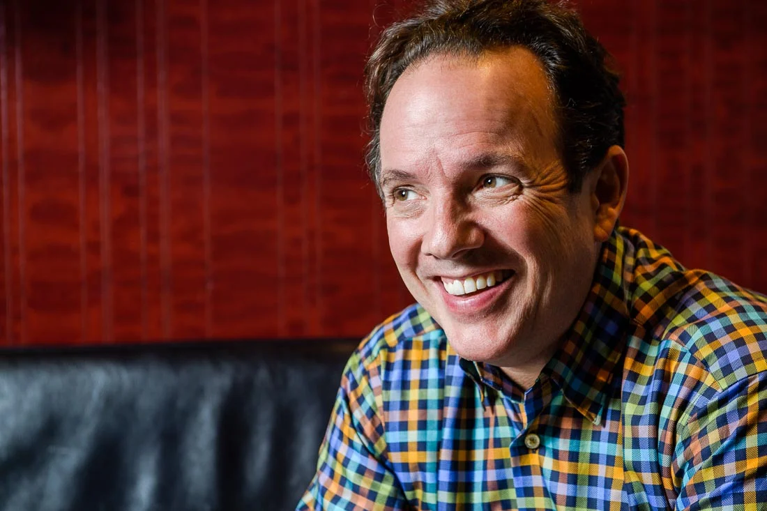 NYC Branded Lifestyle Portrait John Andrews laughing while looking off camera