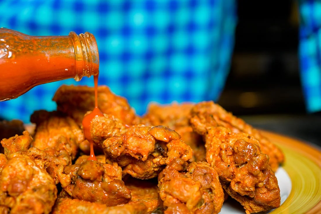 Branded Lifestyle Portrait chef author Daina Falk prepping wings