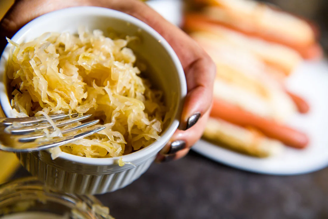 Branded Lifestyle Portrait chef author Daina Falk prepping saurkraut