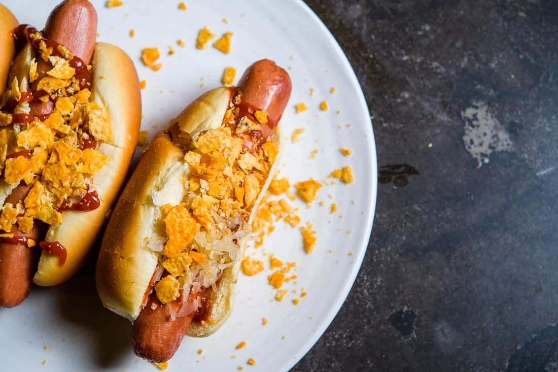 Branded Lifestyle Portrait chef author Daina Falk hot dogs plated