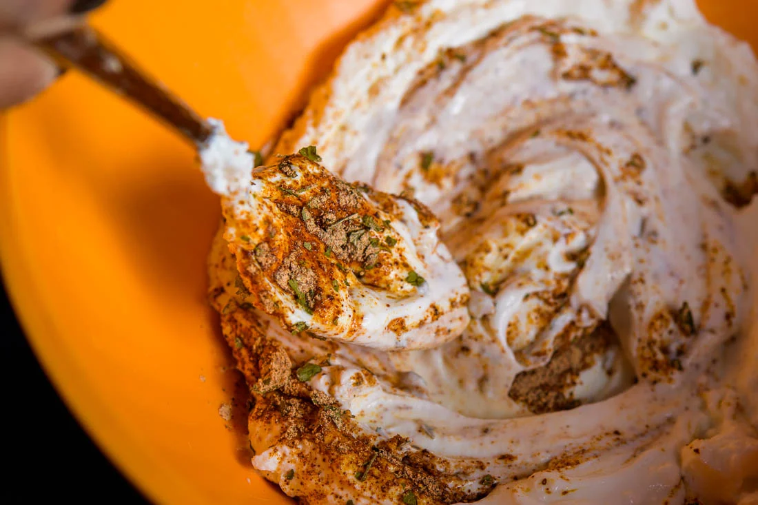 Branded Lifestyle Portrait chef author Daina Falk mixing seasoning close up