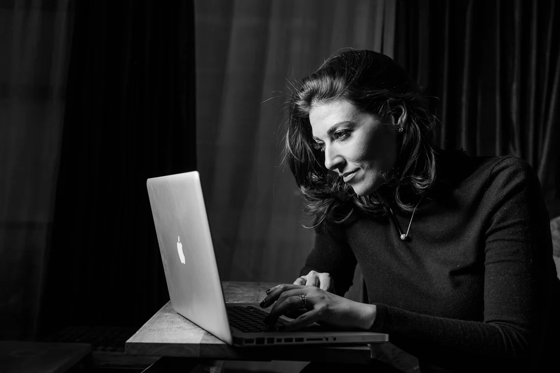 Branded Lifestyle Portrait chef author Daina Falk working on laptop