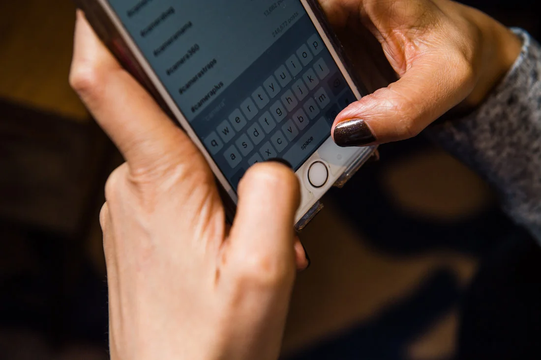 Branded Lifestyle Portrait chef author Daina Falk typing on phone closeup