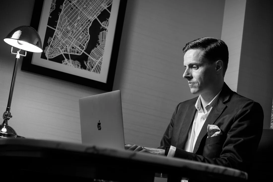 Branded Lifestyle Portrait Speaker Coach James Taylor working on laptop