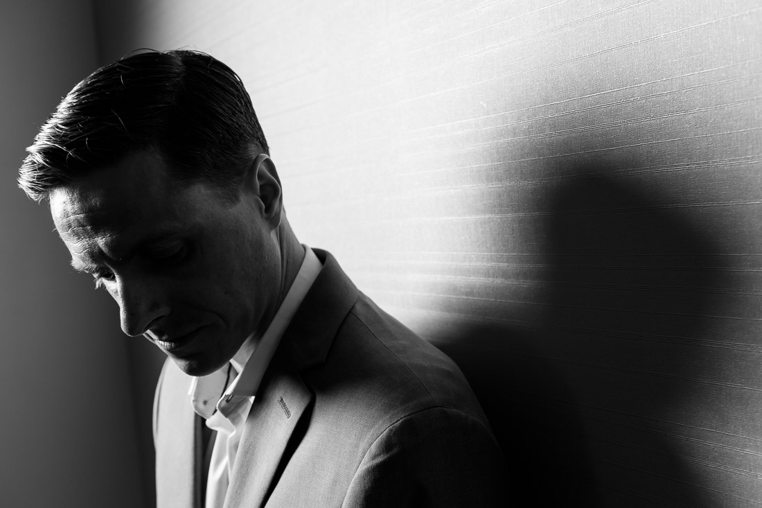 Branded Lifestyle Portrait Speaker Coach James Taylor leaning against wall