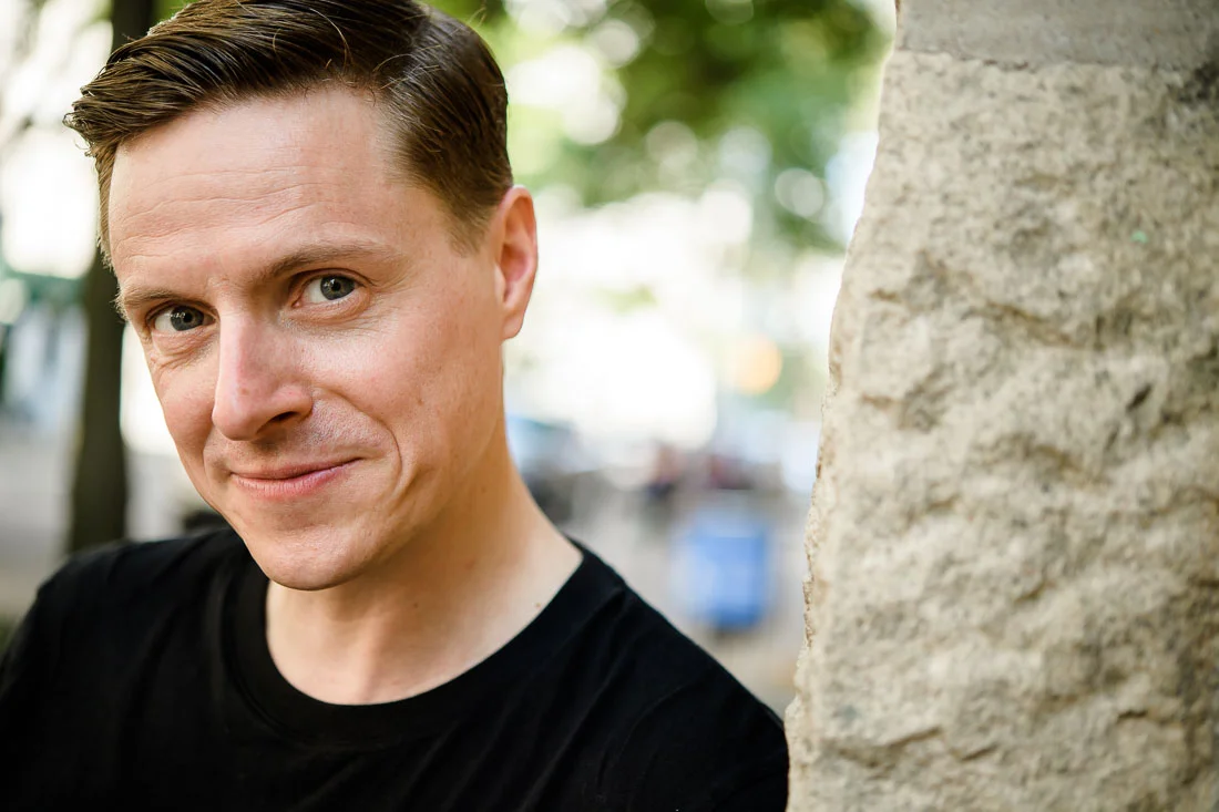 Branded Lifestyle Portrait Speaker Coach James Taylor headshot leaning against tree