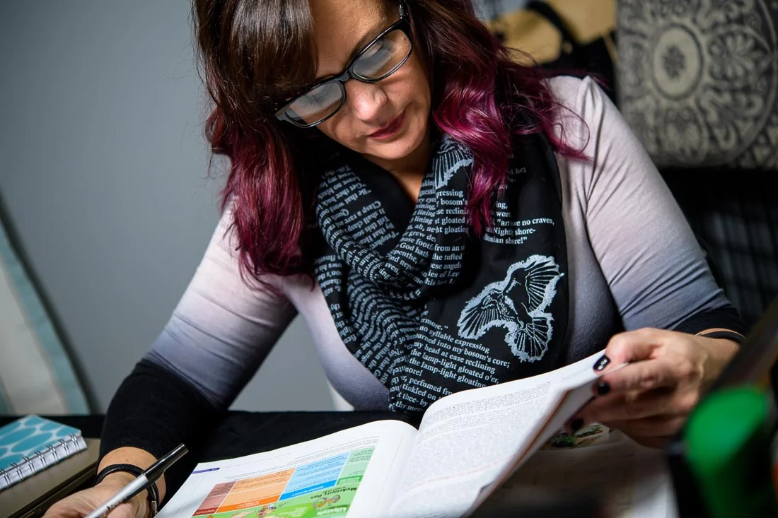 NYC Branded Lifestyle Portrait Tricia Kallmeyer reading through manual