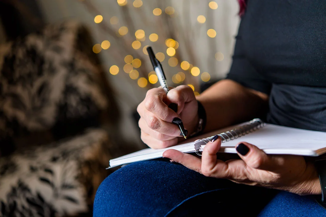 NYC Branded Lifestyle Portrait Tricia Kallmeyer writing down notes in journal