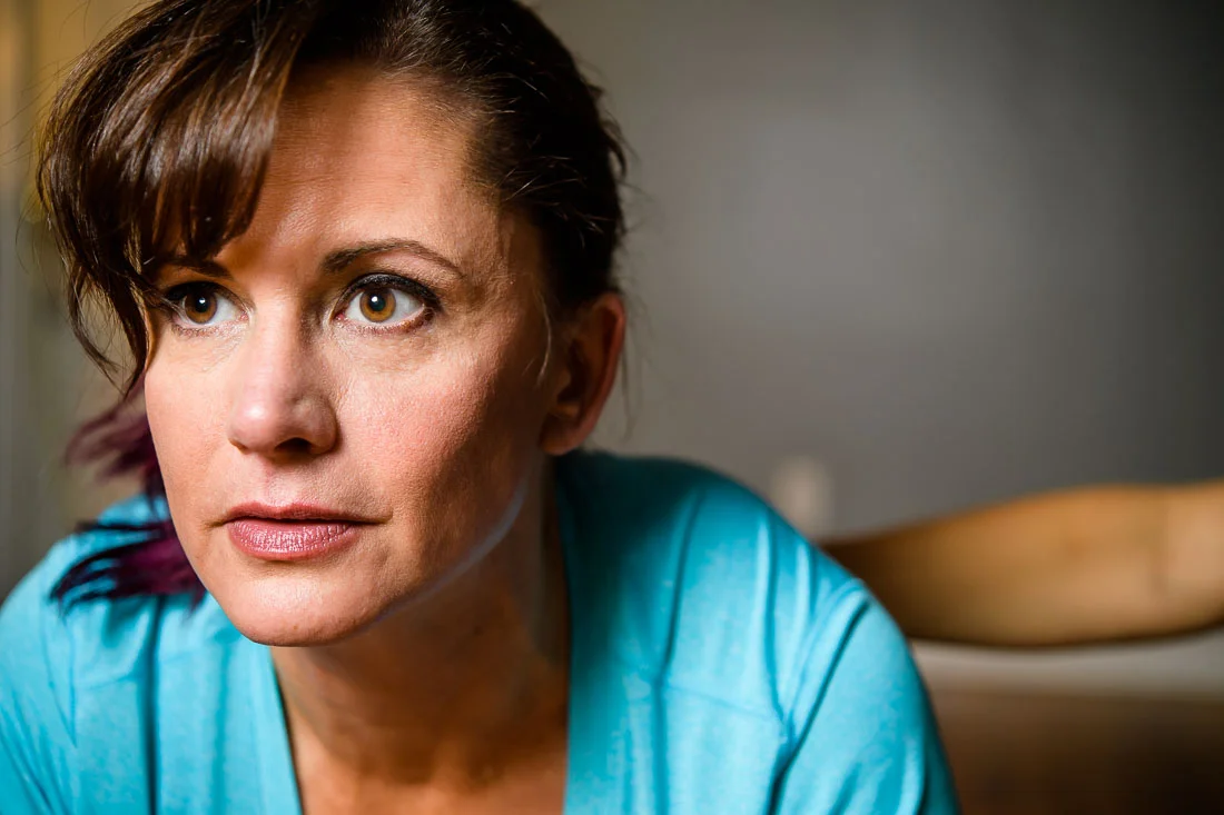 NYC Branded Lifestyle Portrait Tricia Kallmeyer thinking to herself looking off camera