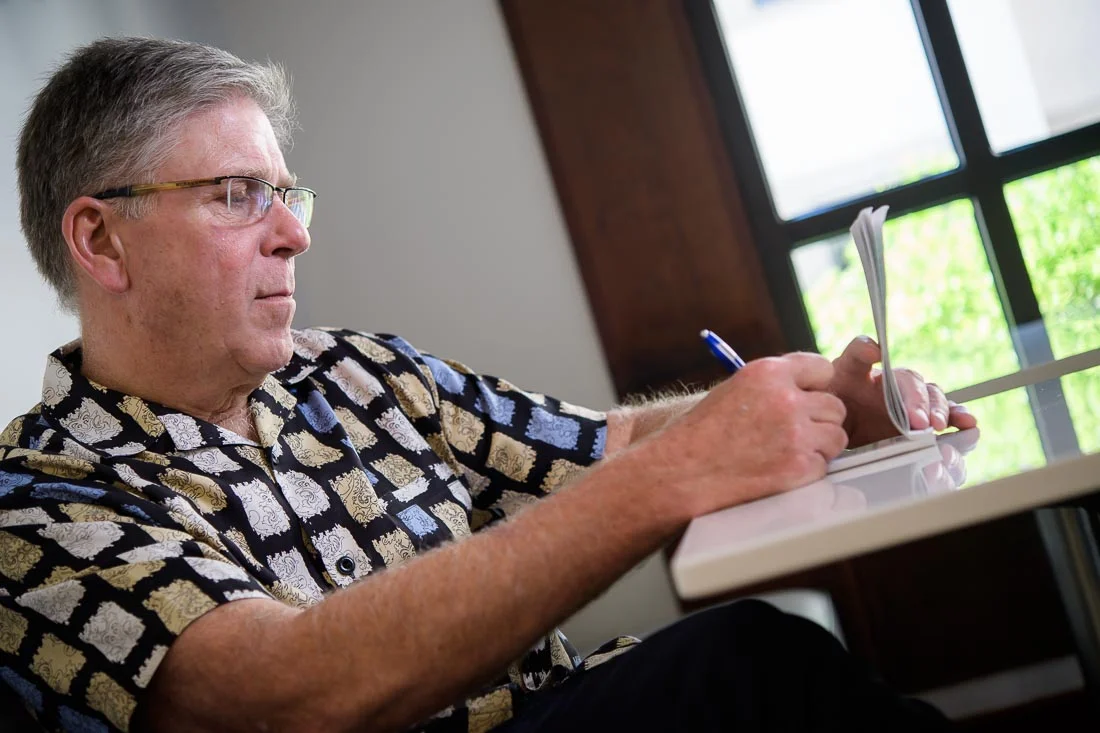 NYC Branded Lifestyle Portrait Randy Owens writing down notes