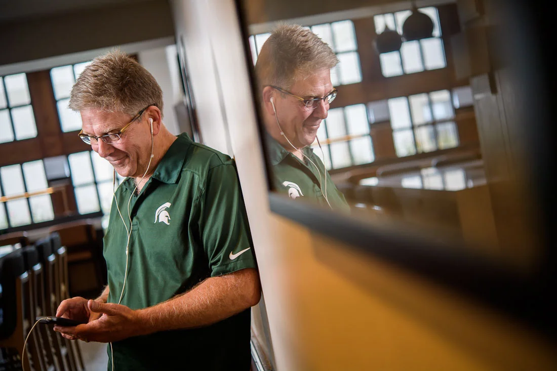 NYC Branded Lifestyle Portrait Randy Owens listening to podcast