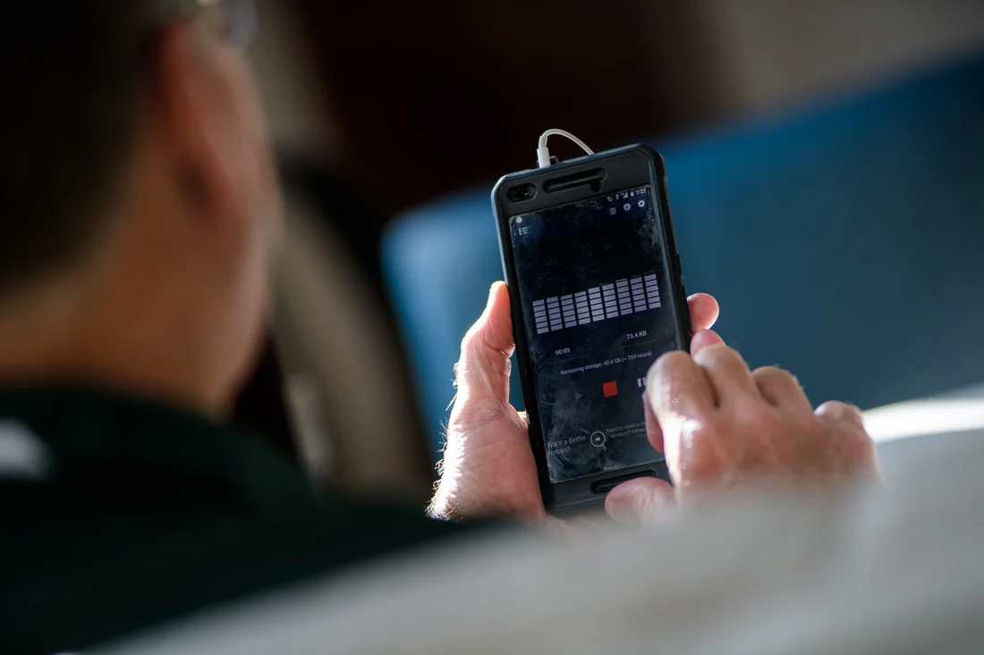 NYC Branded Lifestyle Portrait Randy Owens voice recording into phone