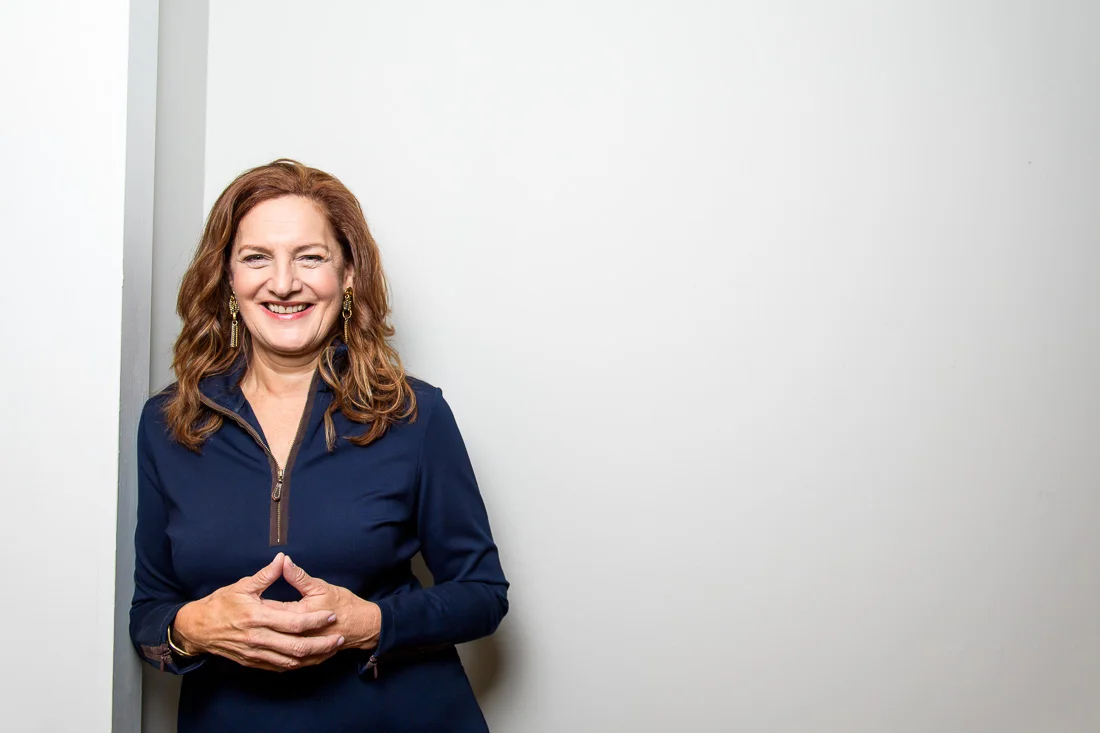 Strategic Social Photography Speaker Kate MacKinnon leaning on wall