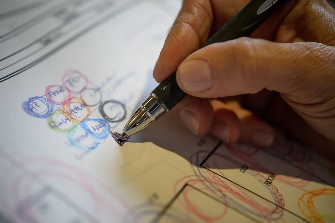 Strategic Social Photography Speaker Kate MacKinnon working on floor plan