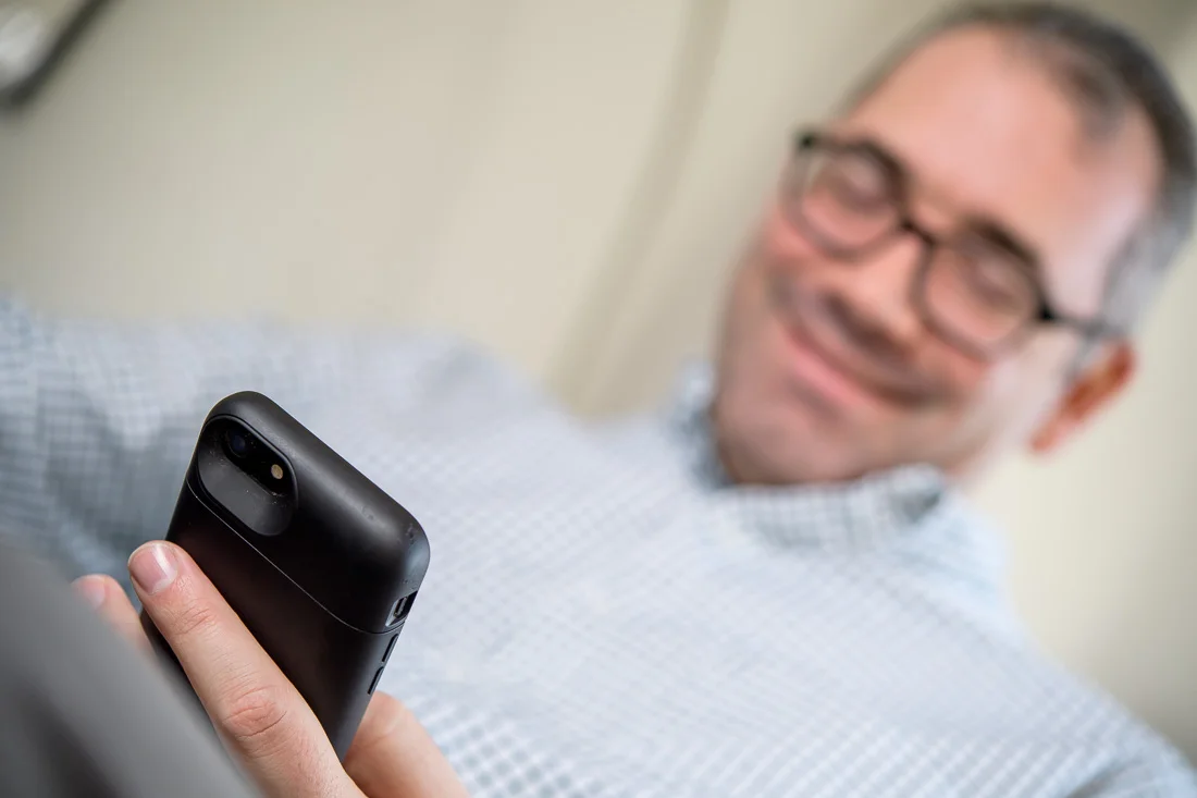 speaker connector thought leader Michael Roderick branded lifestyle portrait detail of phone